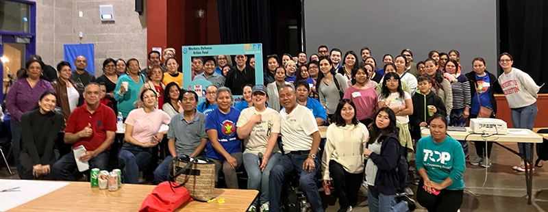 Mixed group of people smiling in a large room